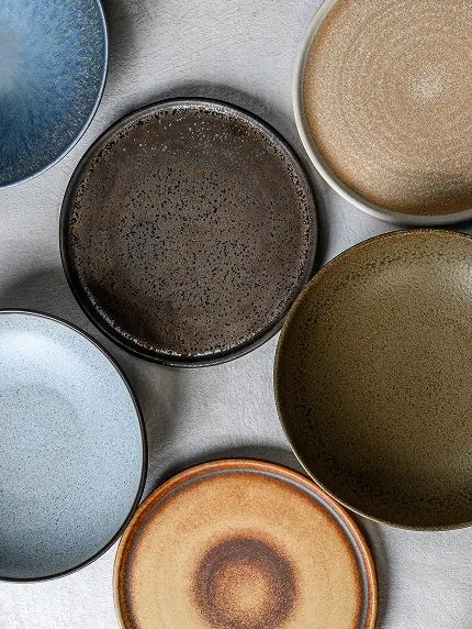 Minimalist stoneware plates and bowls in natural tones