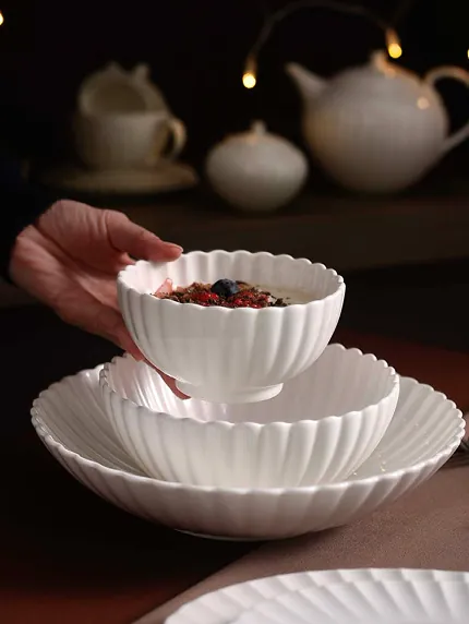 White porcelain cup and saucer arranged on a table
