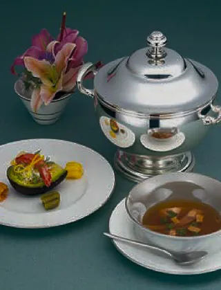 Elegant table setting with metal serving pieces