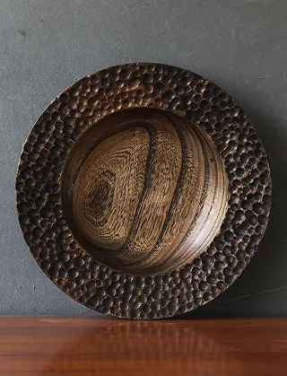 Round wooden serving bowl on a table